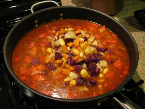 Adding root veggies to rice mixture