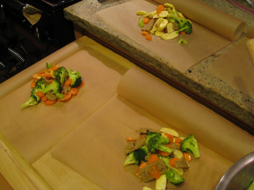 Folding the parchment paper helps keep it open during loading. Very helpful.