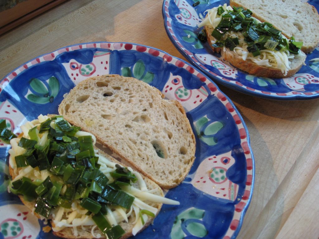 Pile provolone and leeks on one side of the bread