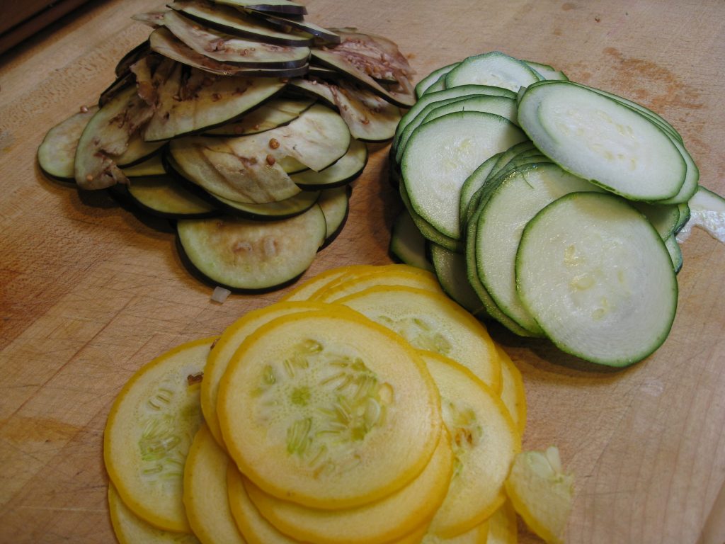 Sliced 1/16th of an inch thin, zucchini, yellow squash and eggplant make perfect playmates. 