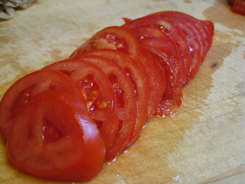 Thinly sliced tomatoes change this dish (for the better, we think). 