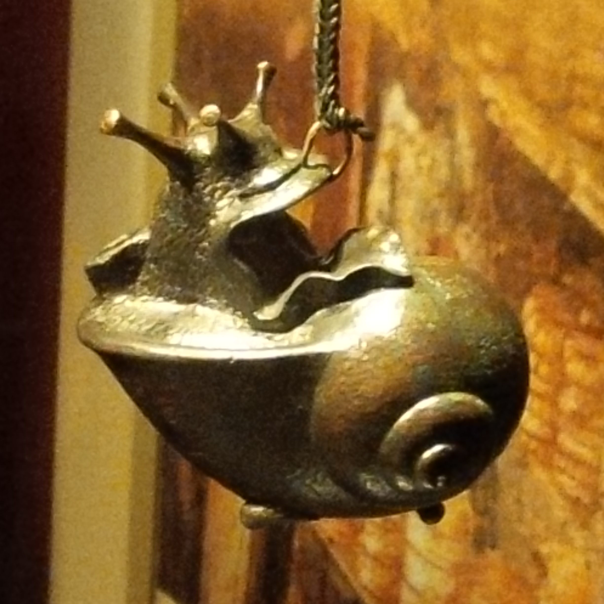Snail as decor in this this oil lamp.