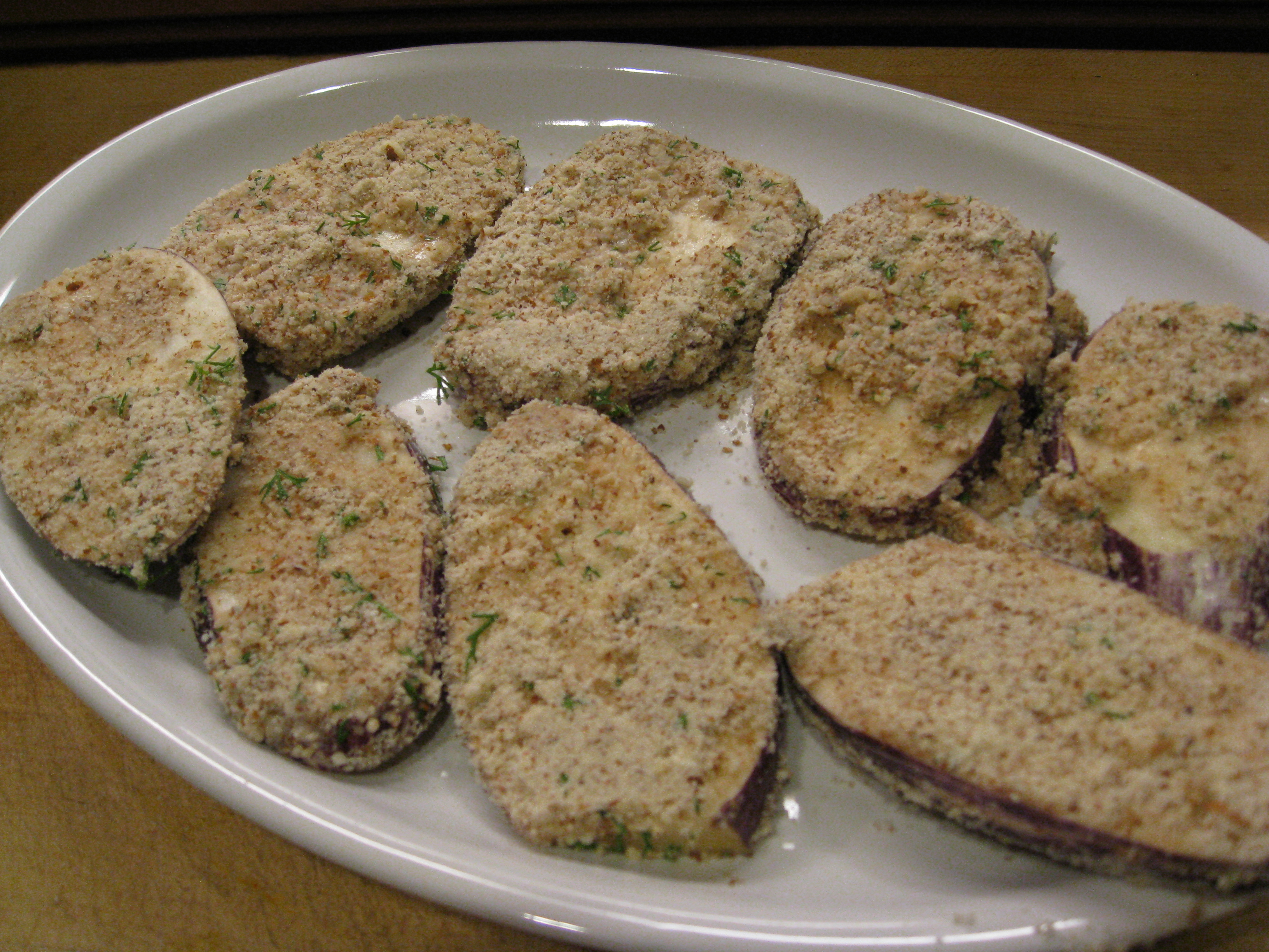 Coated with almonds and herbs, these eggplants are ready for the fire.
