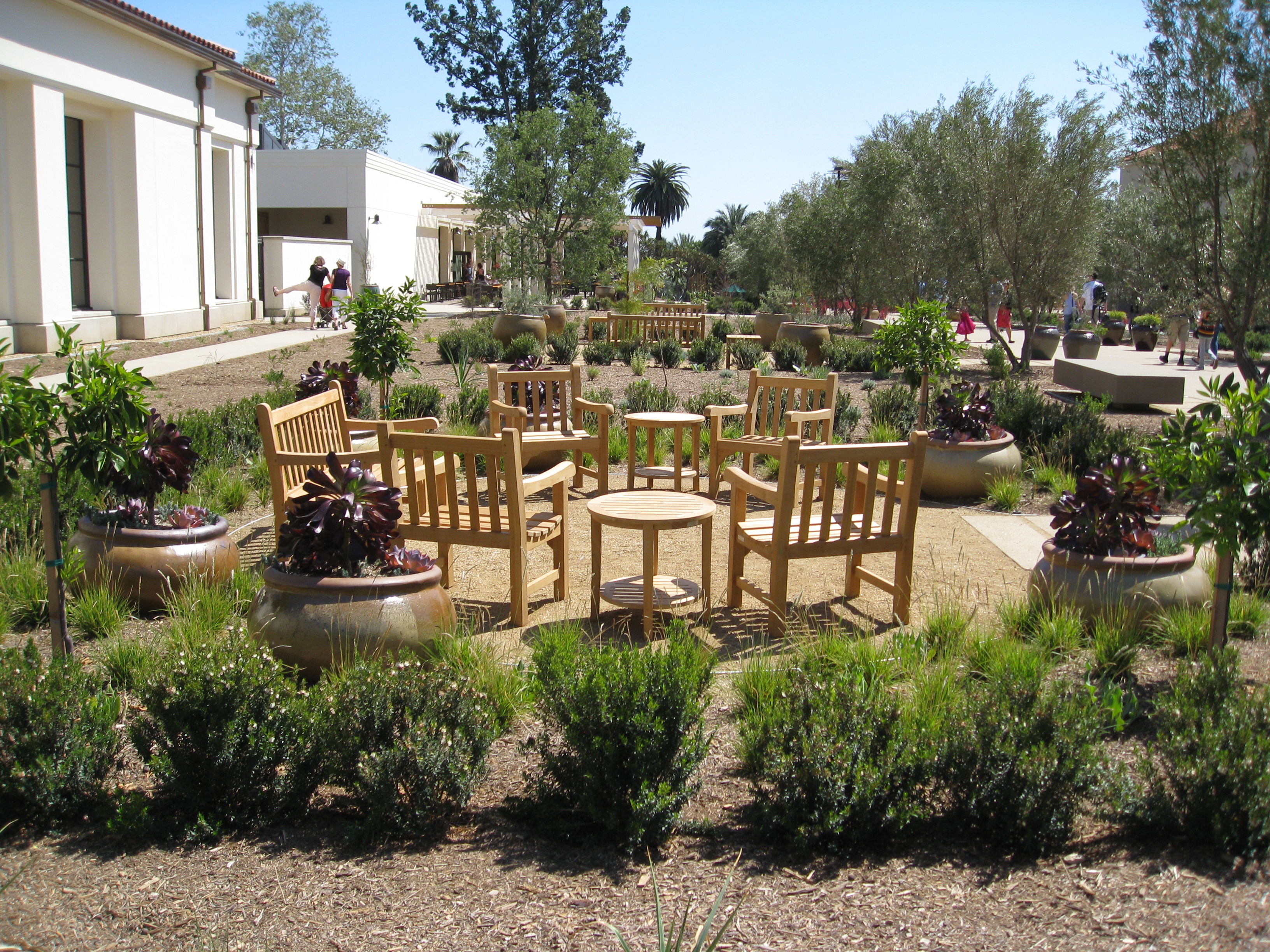 Seating areas surrounded by drought tolerant plants will provide a charming place to tuck away after a long walk through the gardens.